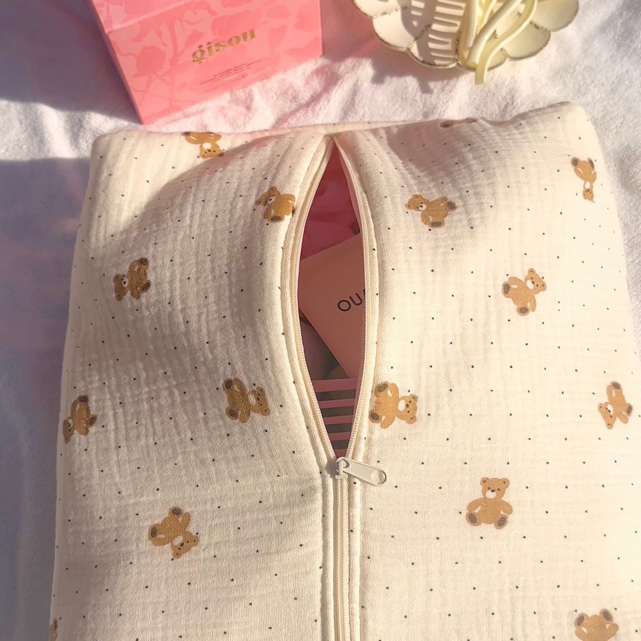 Cream zip pouch with teddy bear polka dot print, open view showing pink interior