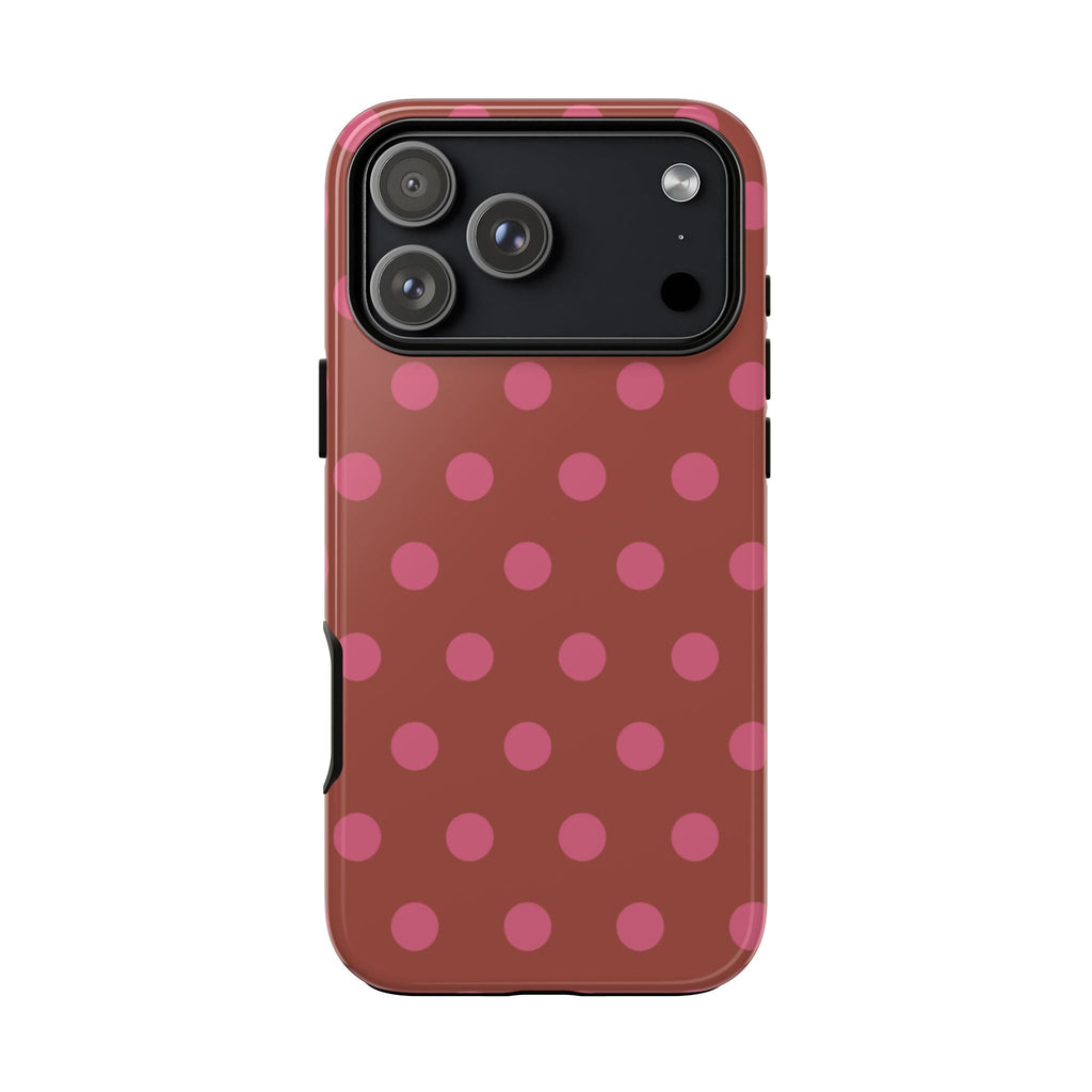 Terracotta polka dot phone case with pink dots and black camera frame on back