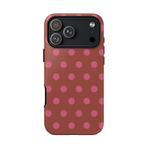 Terracotta polka dot phone case with pink dots and black camera frame on back
