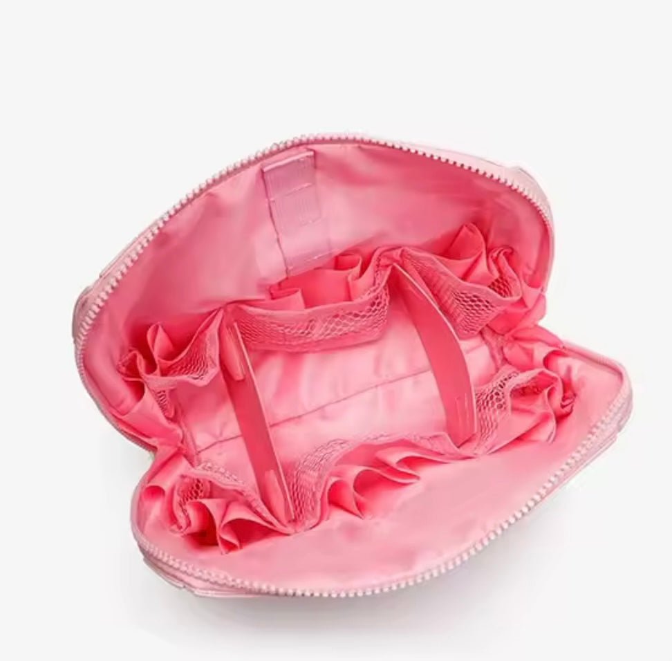 Pink compact flex case with open top, satin interior, elastic strap compartments