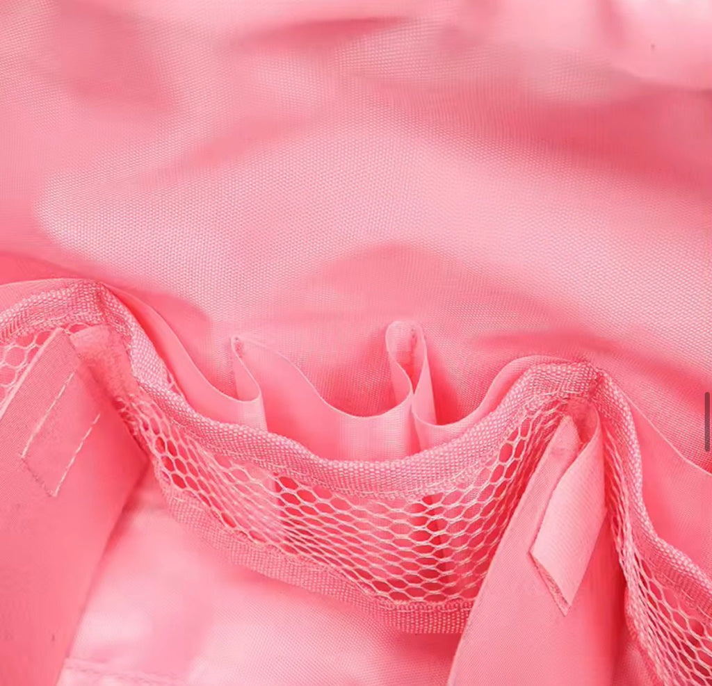 Close-up of pink mesh pocket inside compact flex case with drawstring pouch