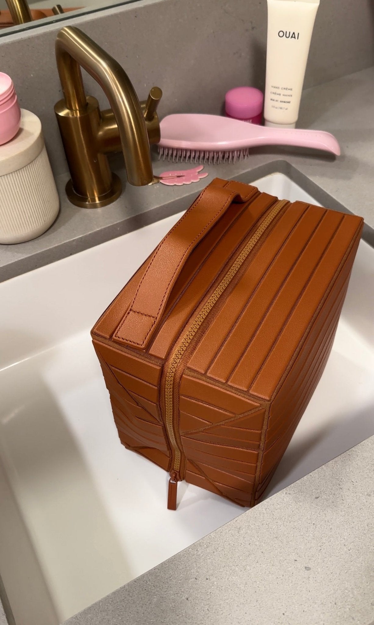 Mocha brown grab-all flex case XL with ribbed panels and front strap, closed with zipper