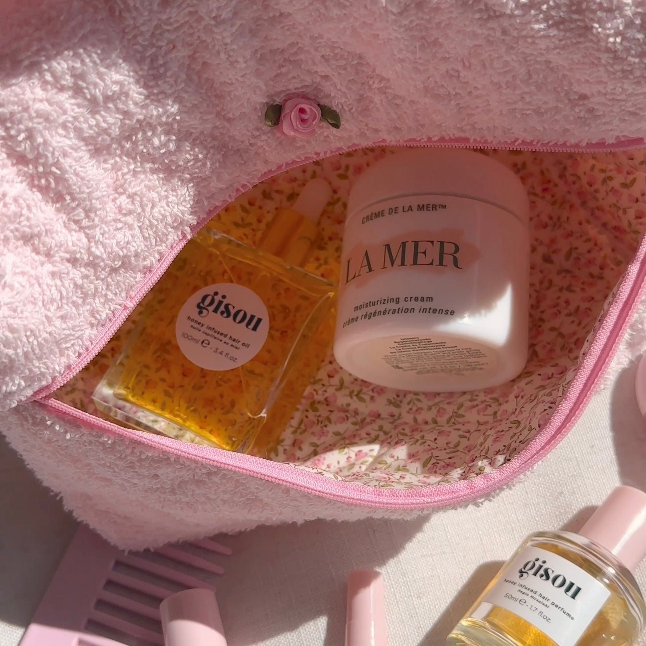 Baby pink teddy handbag open view, plush lining with pink zipper edge