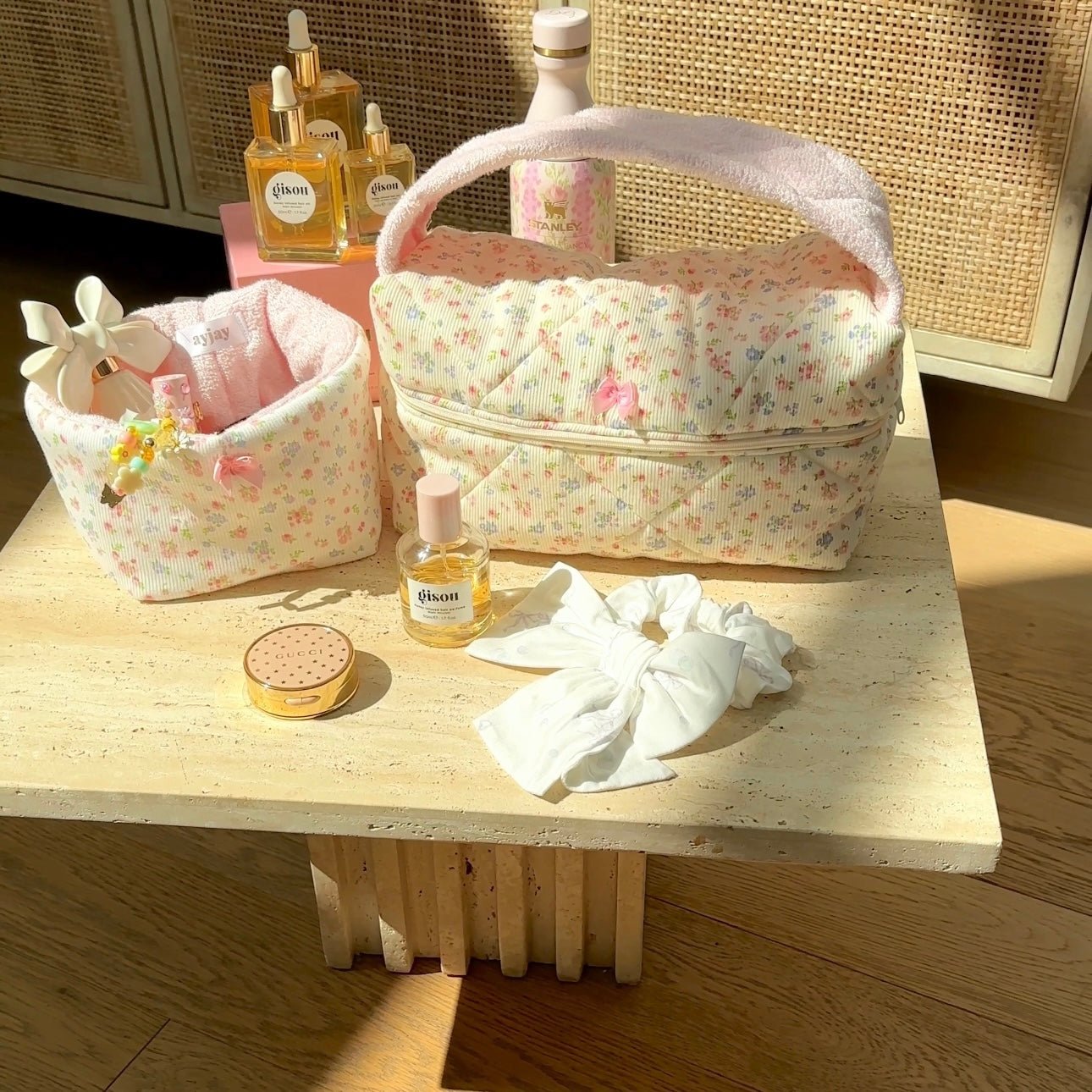 Pink floral zip-top handbag with padded handle and stitched side trim