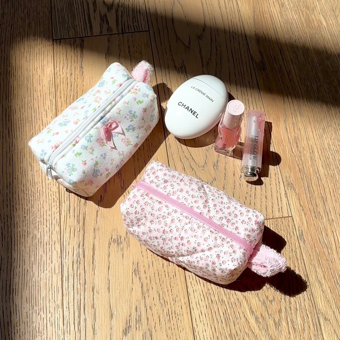 Pink ditsy floral mini zip pouch bag with pom-pom keychain detail