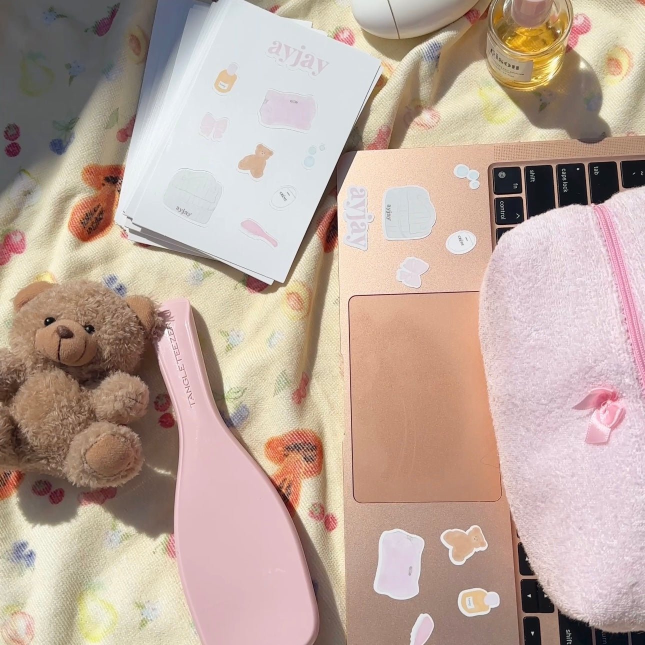 Pastel sticker sheet with bear, clothing shapes, and bunny icons