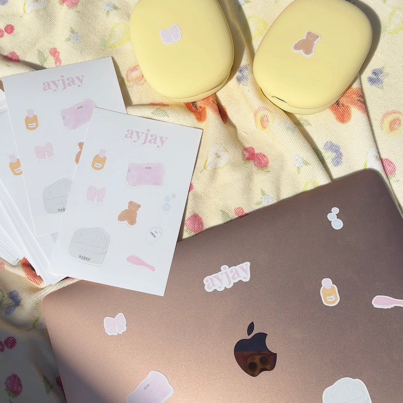 Sticker sheet with pastel icons: butterfly, bear, bottle, and heart designs
