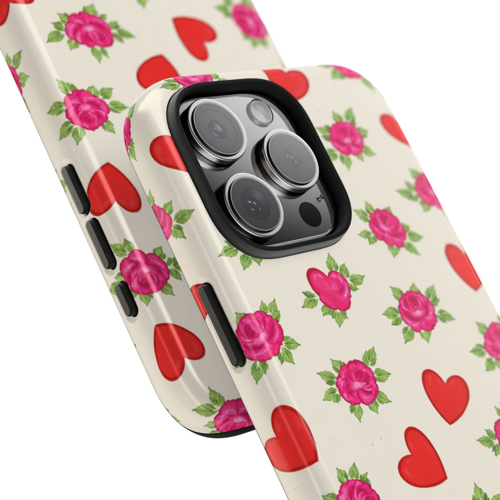 Close-up floral phone case showing rose-and-heart print around triple camera module