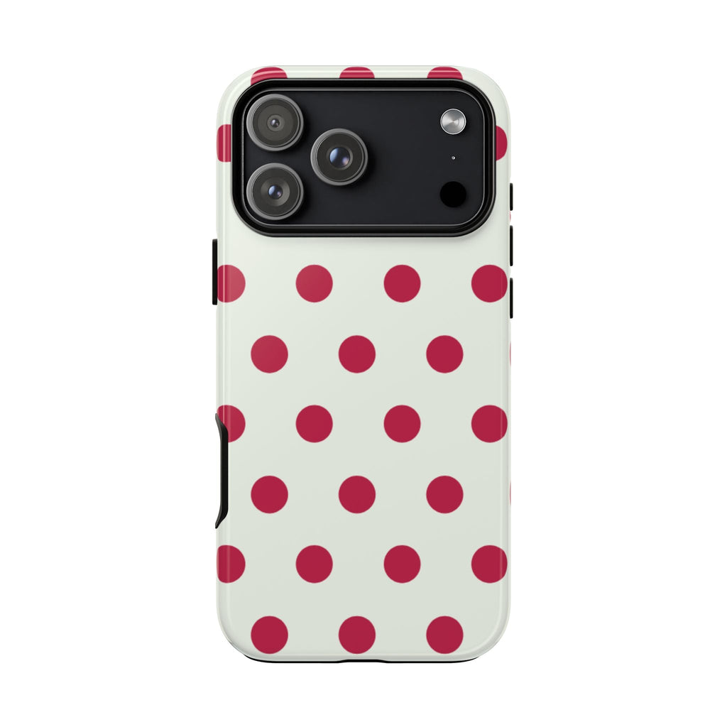 Back of vanilla phone case with red polka dots and raised camera area
