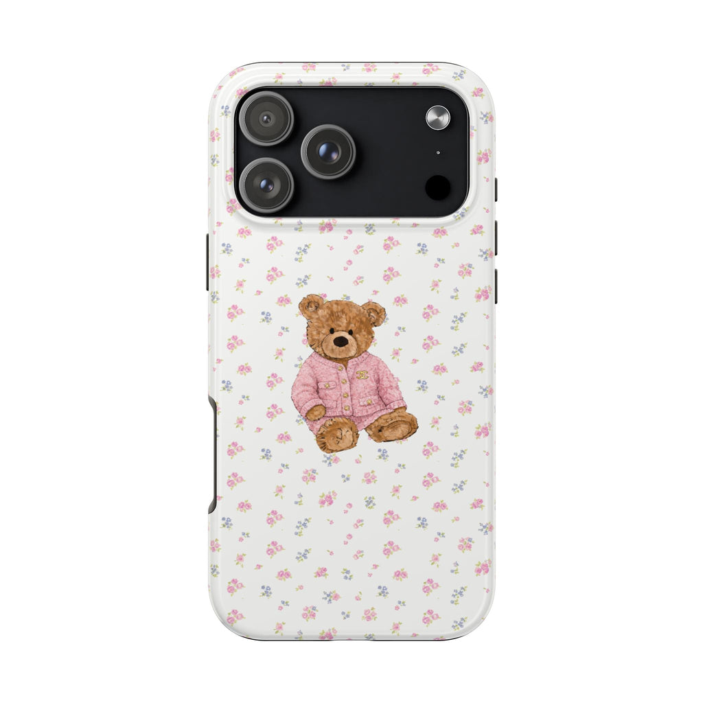 White phone case with pink floral pattern and teddy bear, camera and side cutouts