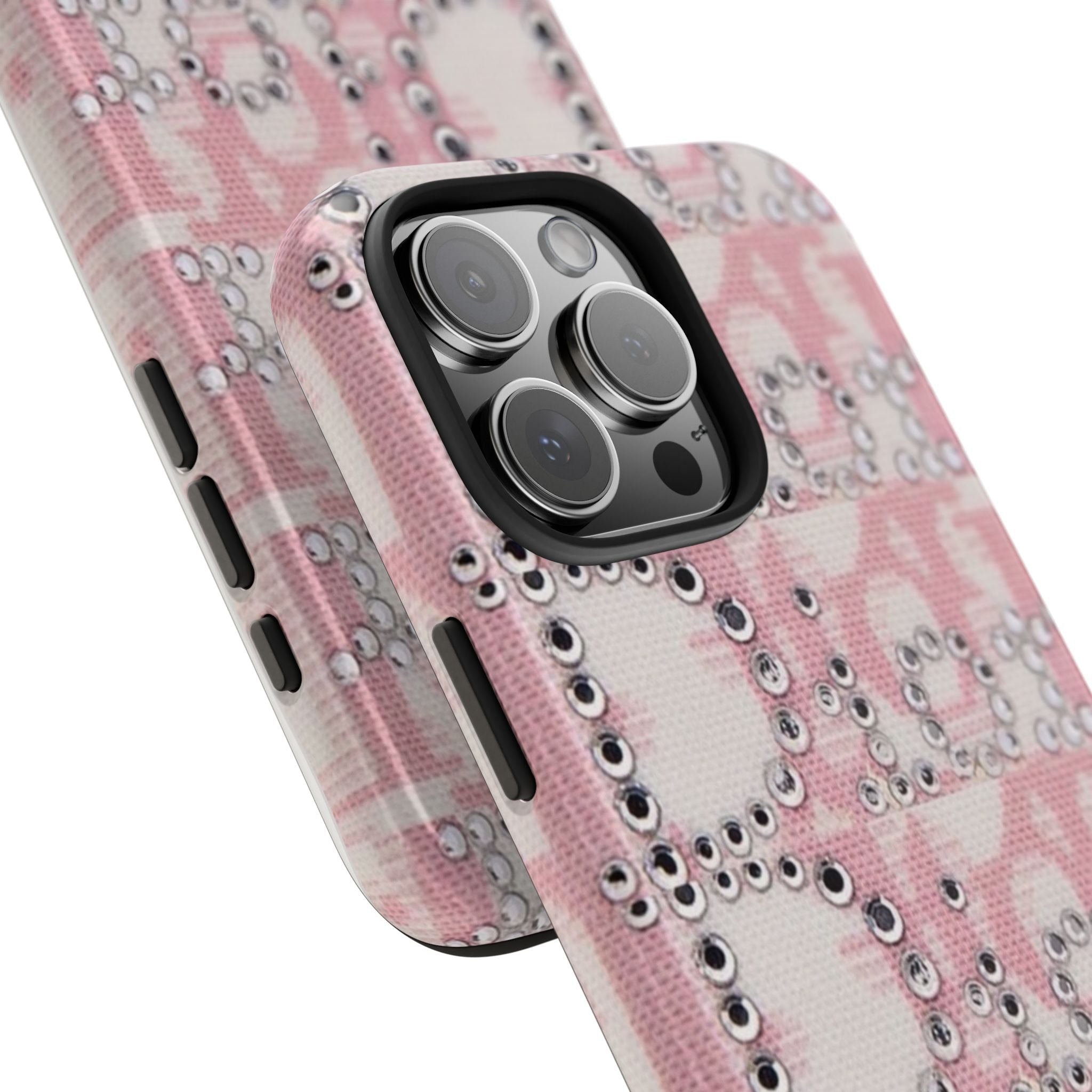 Pink rhinestone phone case close-up showing camera opening and crystal-studded texture