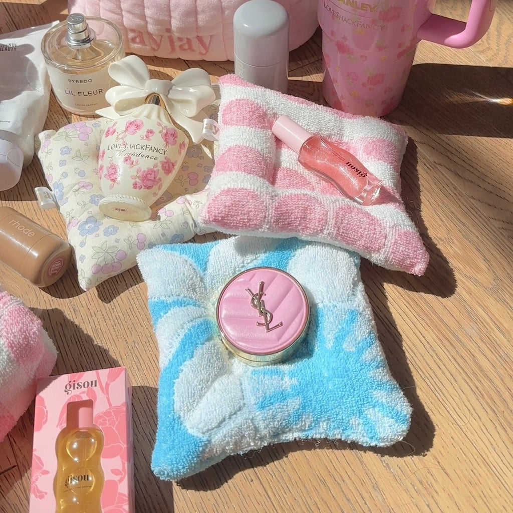 Light blue plush teddy cloud coaster with pink logo button center