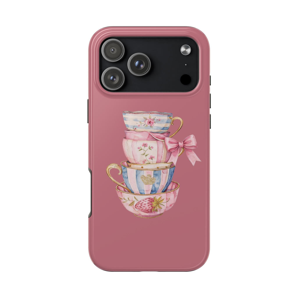 Rose-pink phone case featuring stacked teacups with ribbon bow, matte look
