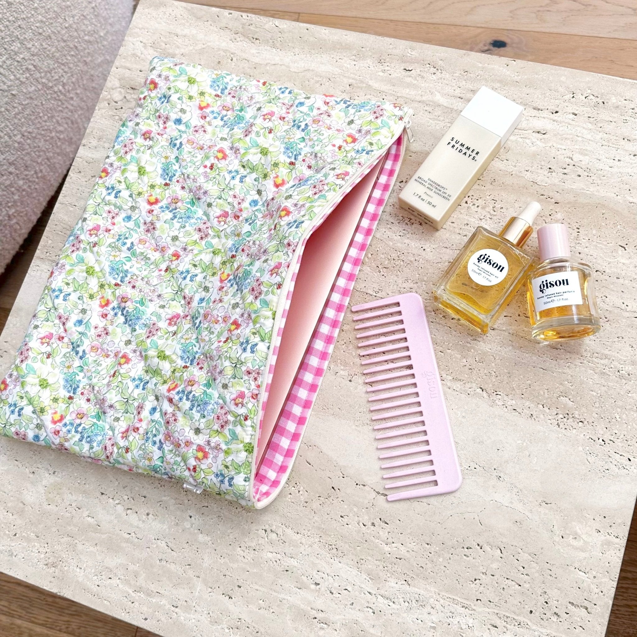 Floral zip pouch, front view with pink gingham lining, fully open