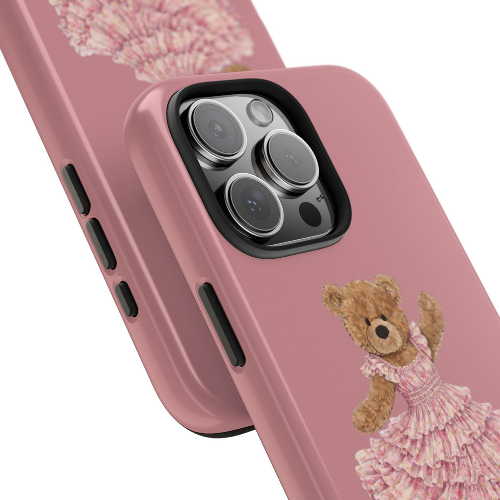 Rose pink phone case angled view: teddy bear detail near bottom, side buttons visible