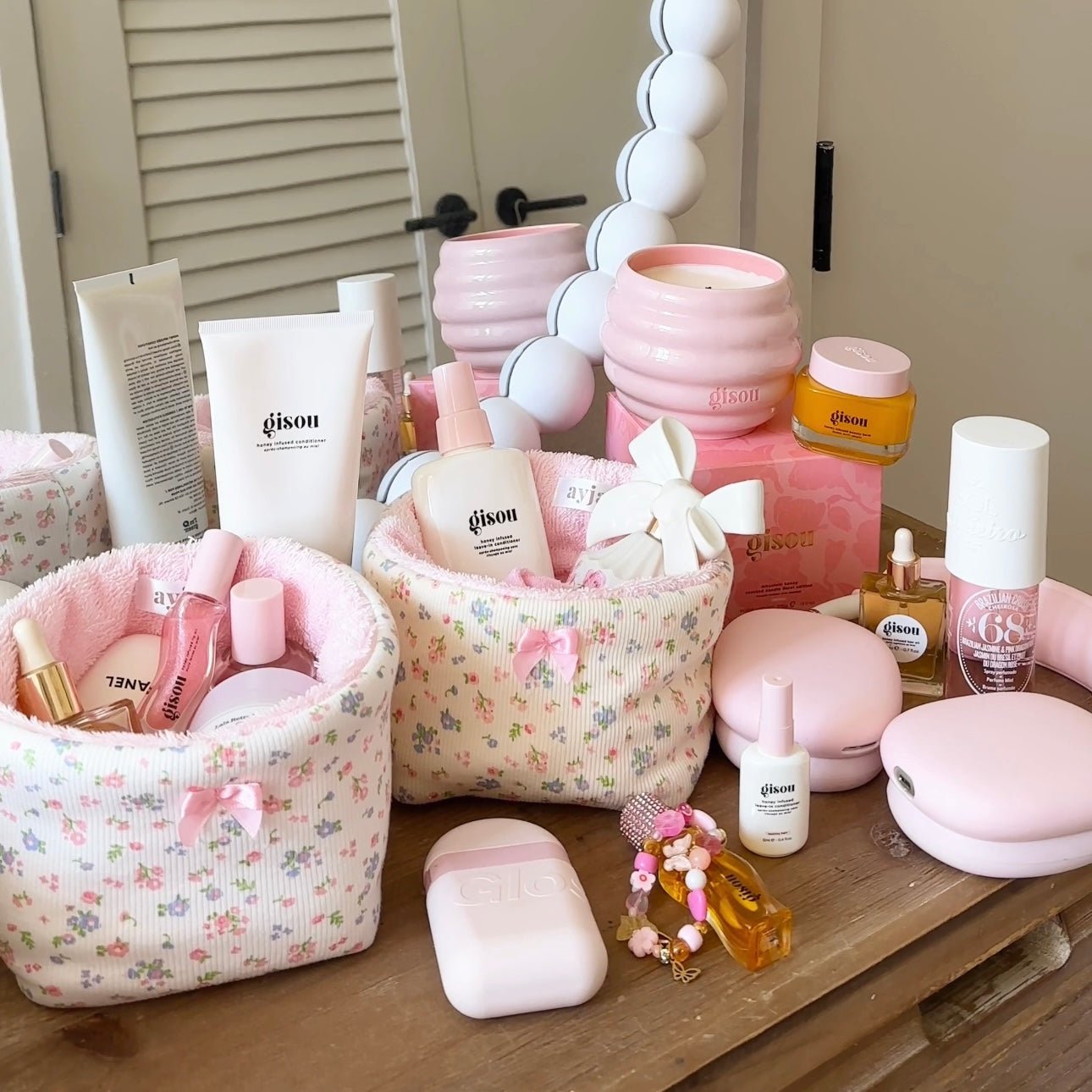 Floral organizer basket set with pink accents and toiletries bottles