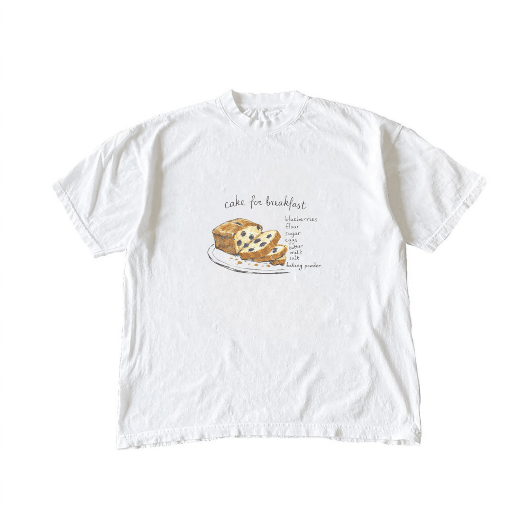 White crewneck T-shirt with blueberry cake on plate and small recipe text, front