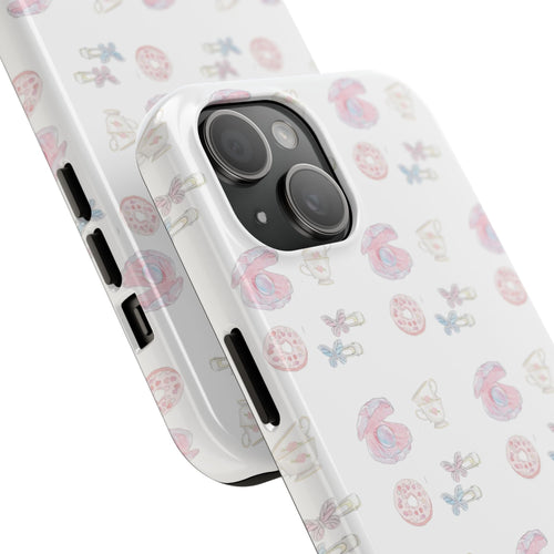 White pearled shell phone case, angled view with pastel seashell pattern and side buttons