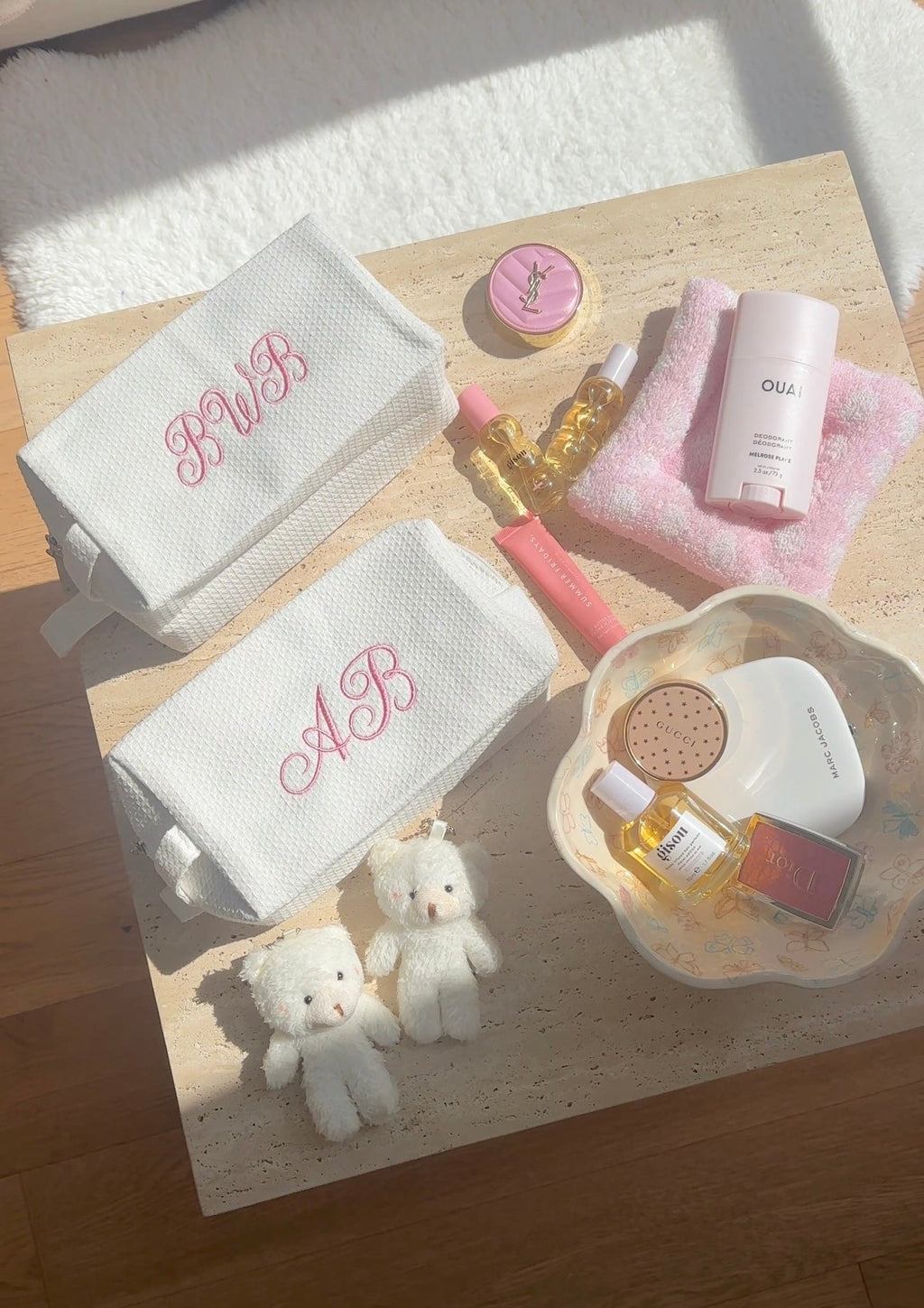 White waffle knit bag with pink cursive monogram embroidery on front