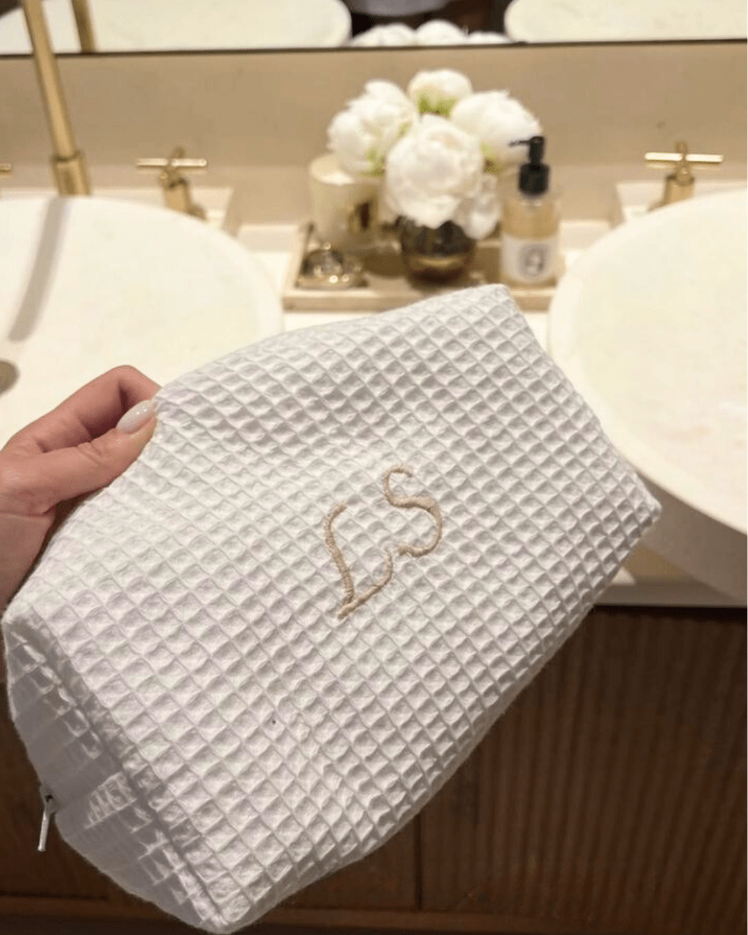 White waffle knit custom embroidery bag with gold script name on front