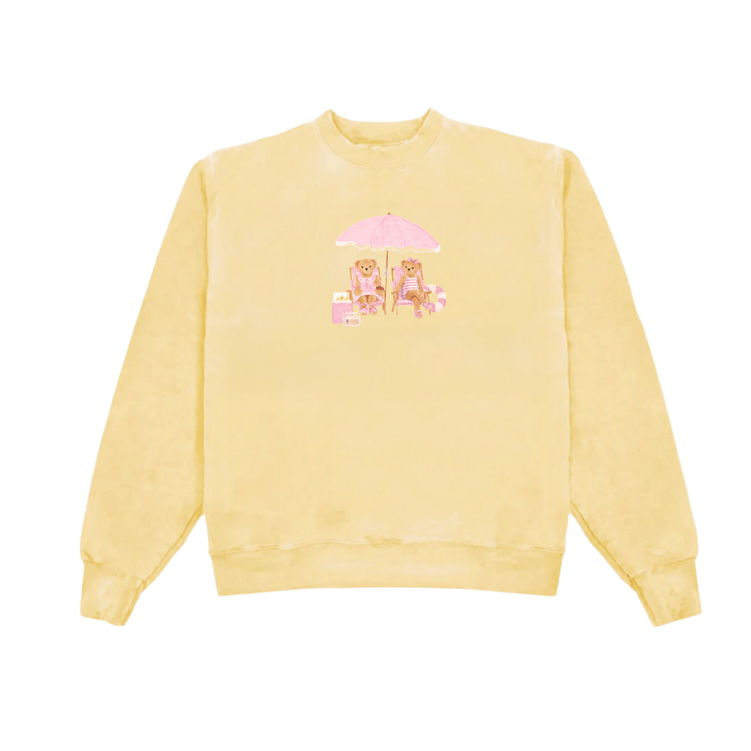 Front view yellow crewneck sweatshirt with pink umbrella beach graphic