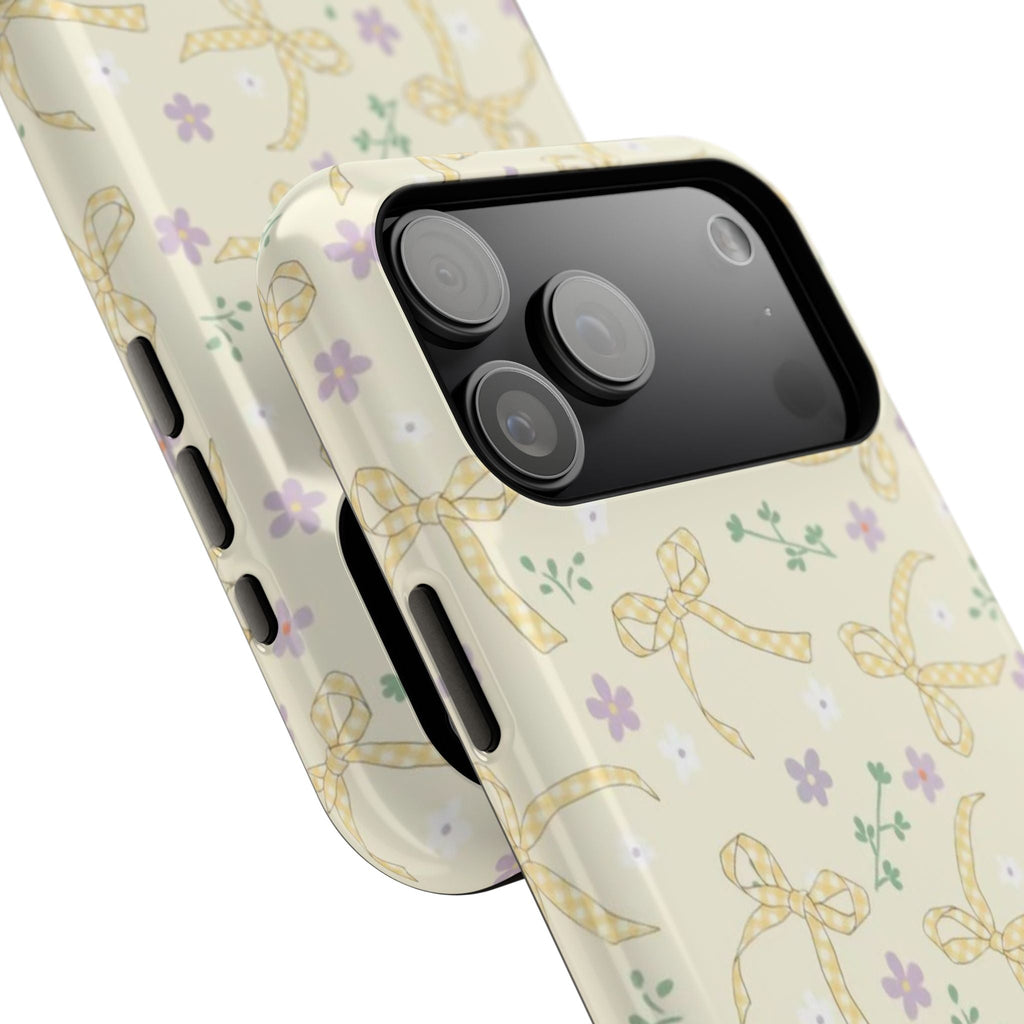 Bow floral phone case, angled view showing patterned back and protective side edges