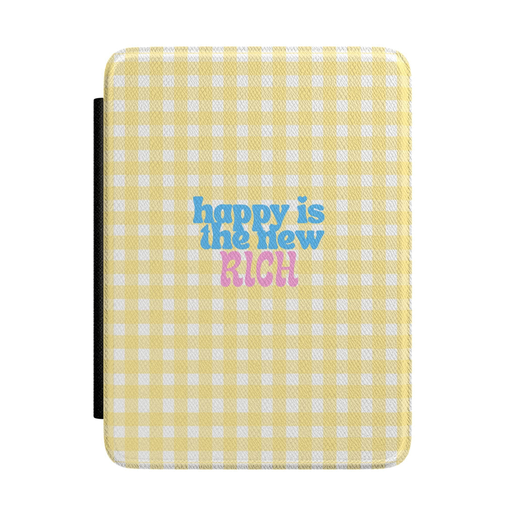 Yellow gingham hardcover Kindle case with “happy is the new RICH” text