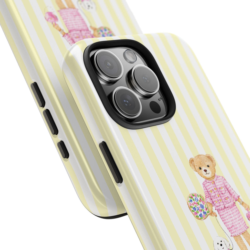 Striped phone case close-up with teddy bear graphic and camera lens openings