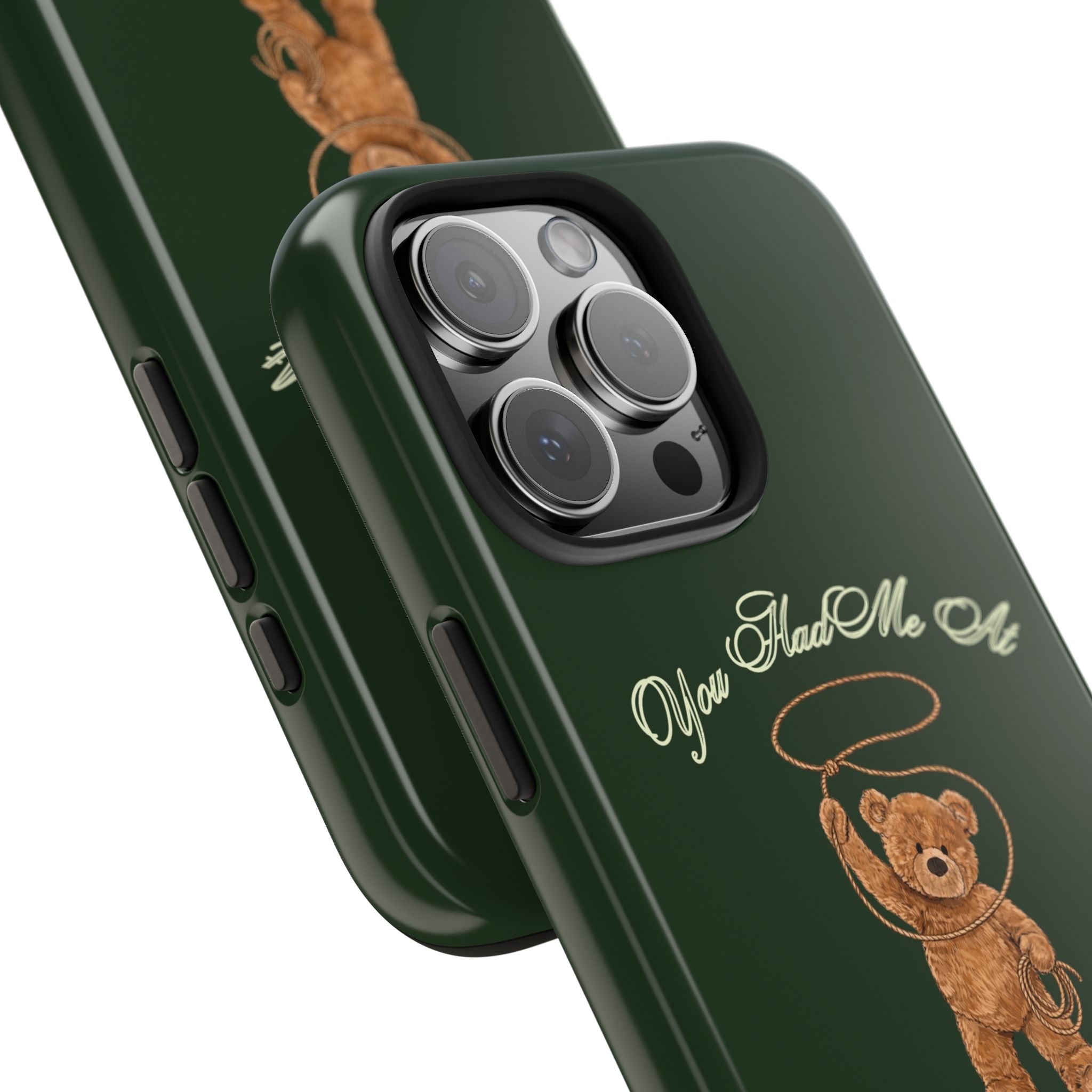 Green phone case close-up: teddy bear graphic near camera cutout and side buttons