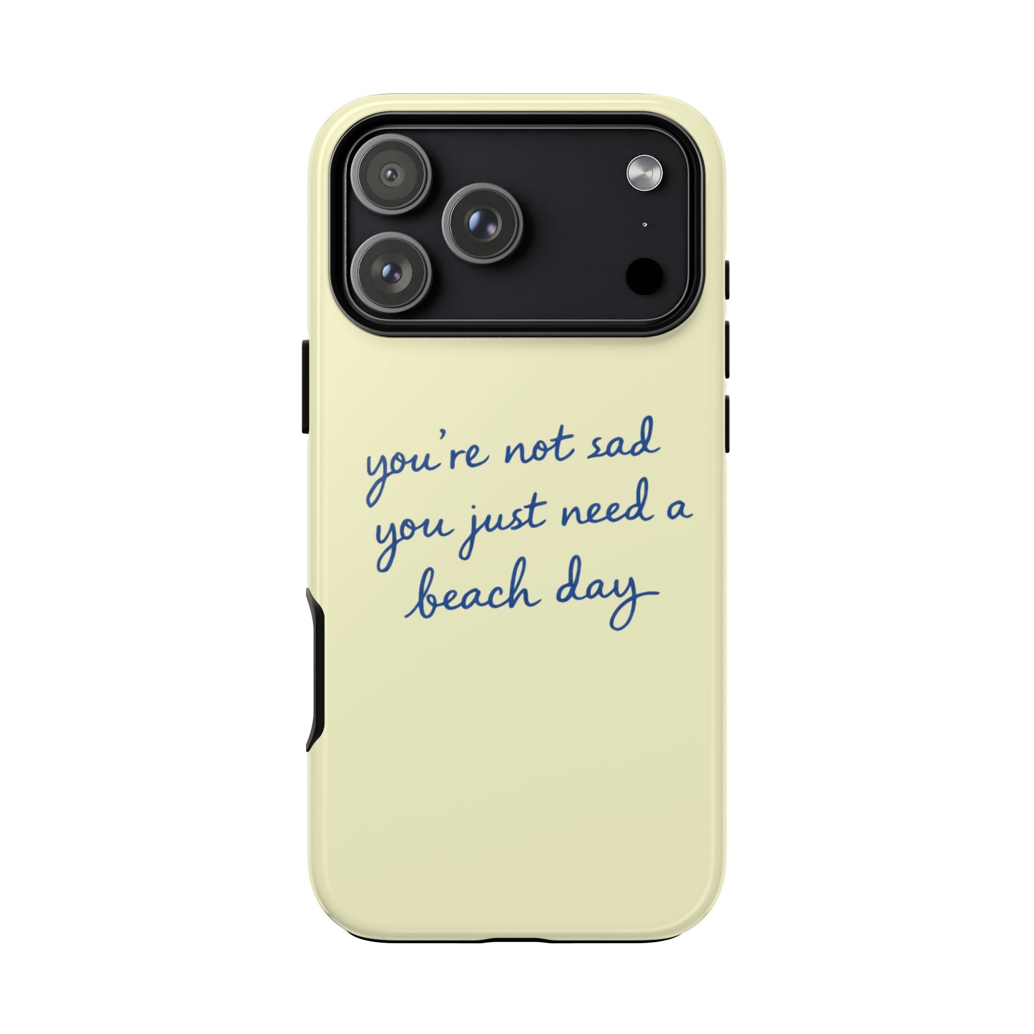 Light yellow phone case with blue “beach day” quote beneath the camera cutout.