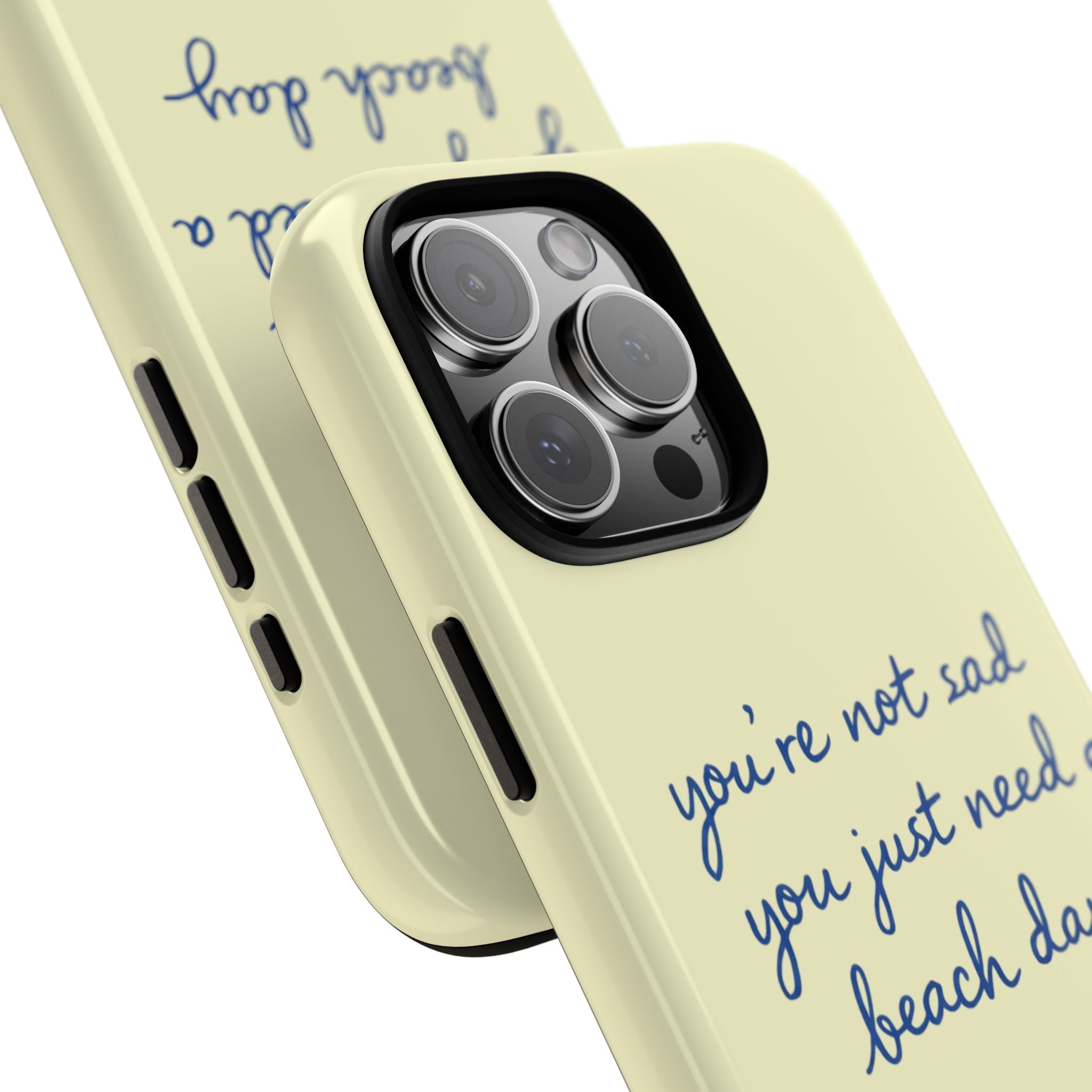 Angled light yellow phone case with blue “beach day” quote and camera lens cutout.