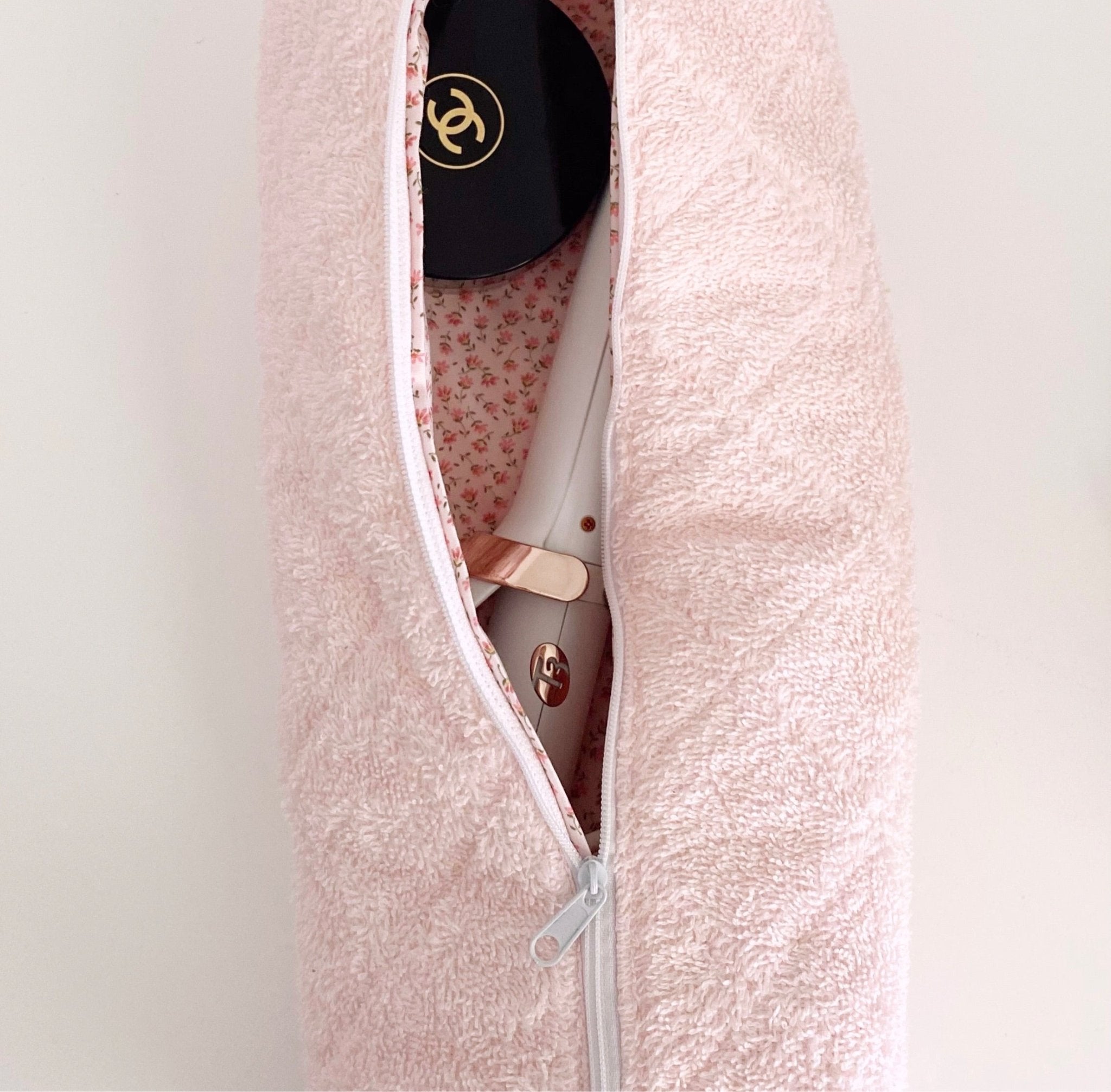 Baby pink terrycloth zip pouch open, floral fabric lining and zipper pull