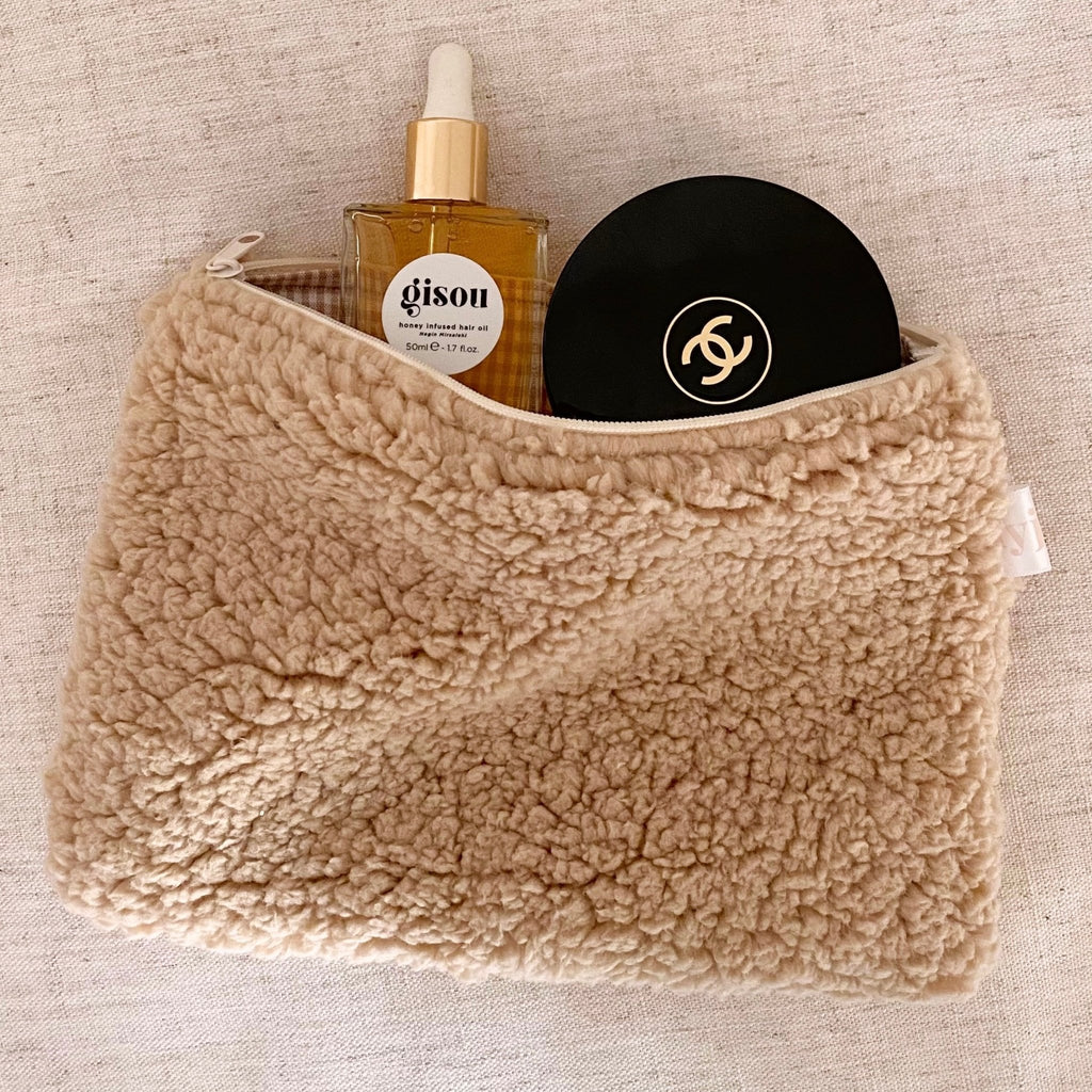 Camel soft teddy gingham zip pouch, fuzzy sherpa exterior in a compact pouch shape