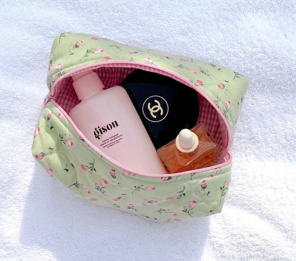 Mint green rose floral toiletry pouch open, pink check lining inside