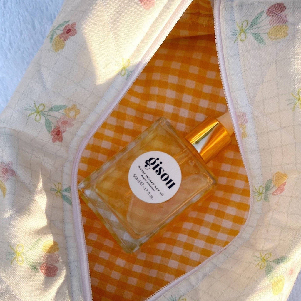 Ivory tulip-print zip pouch interior with orange gingham lining