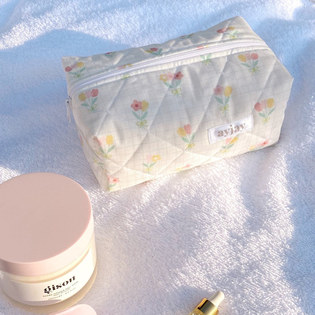Ivory tulip-print quilted zip pouch with front label pocket