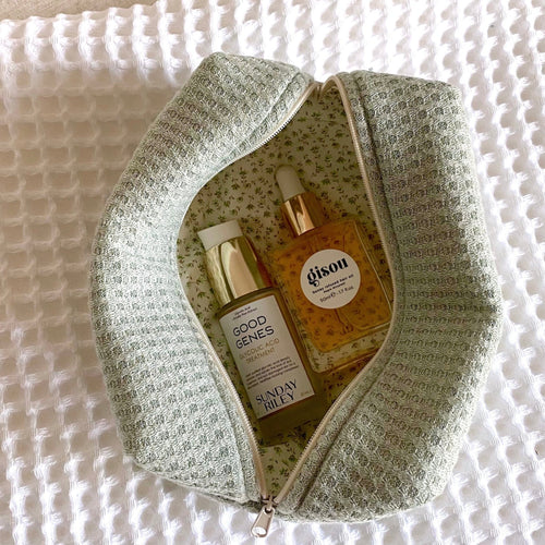 Jade waffle knit zip pouch, sage green texture with floral patterned inner lining.