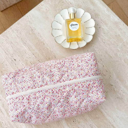 Pink floral zip pouch with white zipper trim