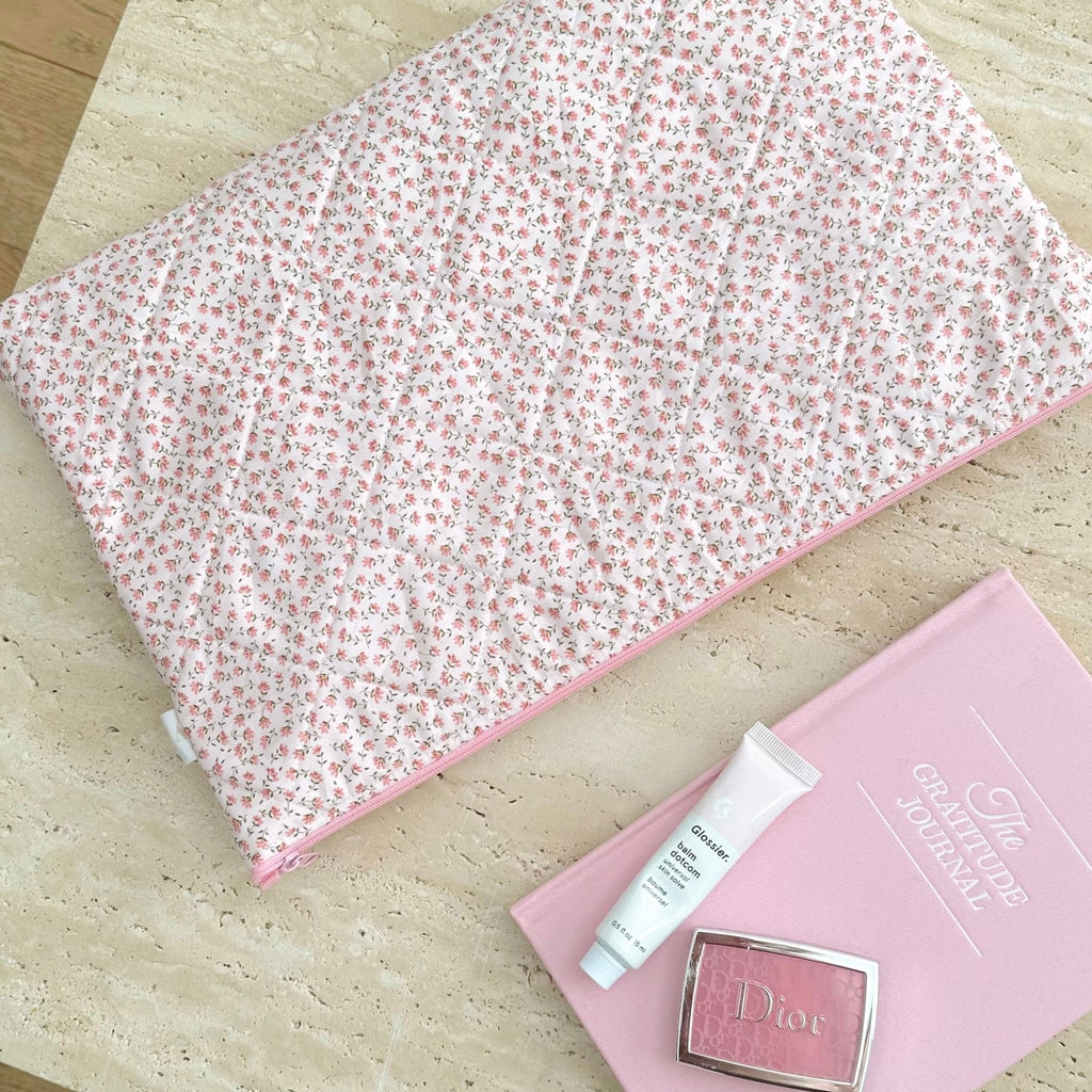 Pink ditsy floral large zip pouch with pink piping, close-up of fabric print