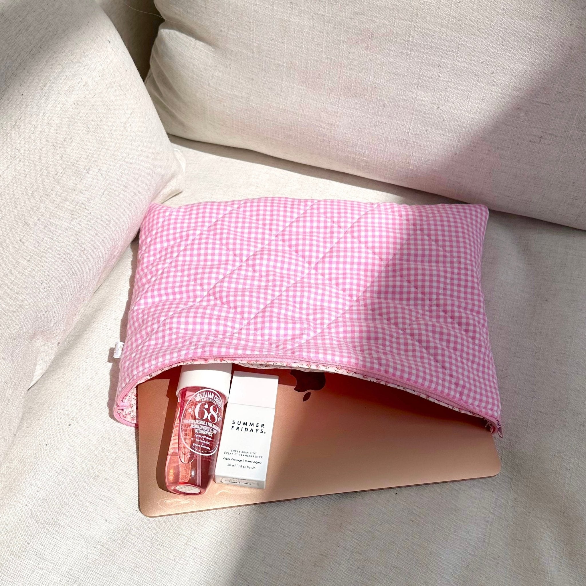 Pink gingham pouch with zip, opened to show inner fabric