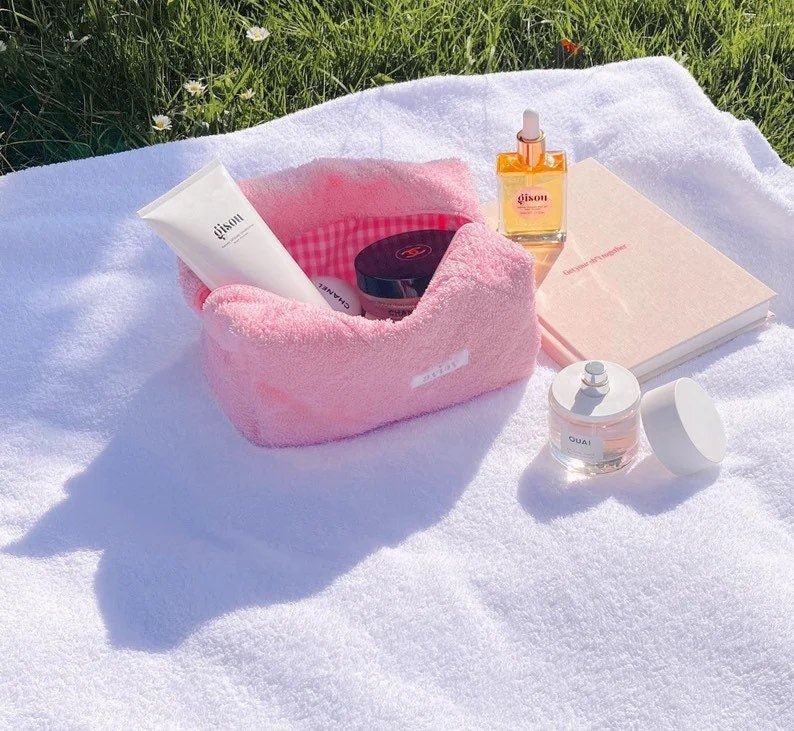 Pink terrycloth gingham pouch with open top, lined interior visible