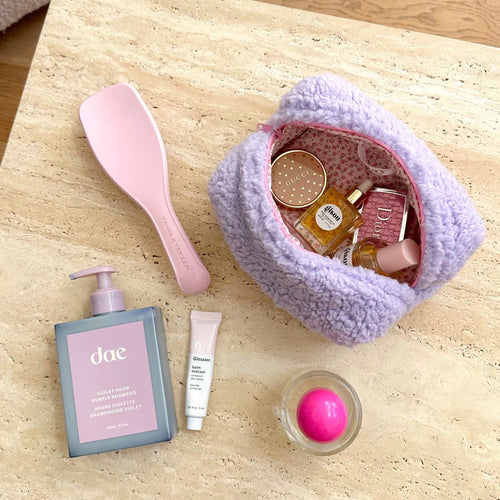 Lavender soft teddy pouch with pink trim, open top showing inner lining