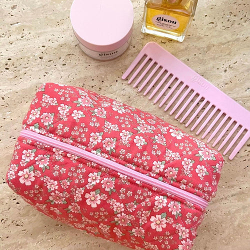 Red floral makeup bag pouch with pink zipper trim, front view