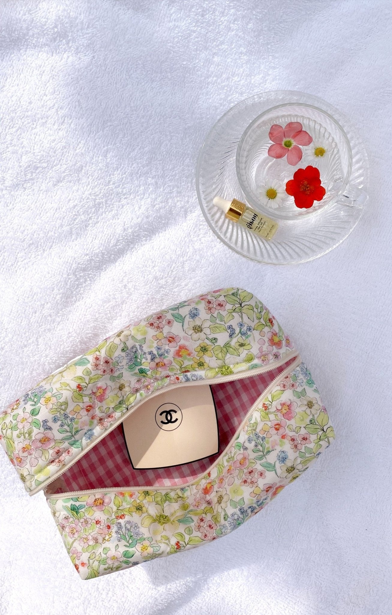Floral zip pouch with matching zipper trim; interior view with pink gingham lining