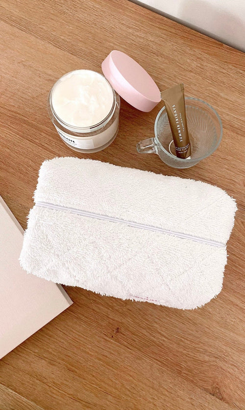 White terrycloth zip pouch, flat rectangular shape with top zipper
