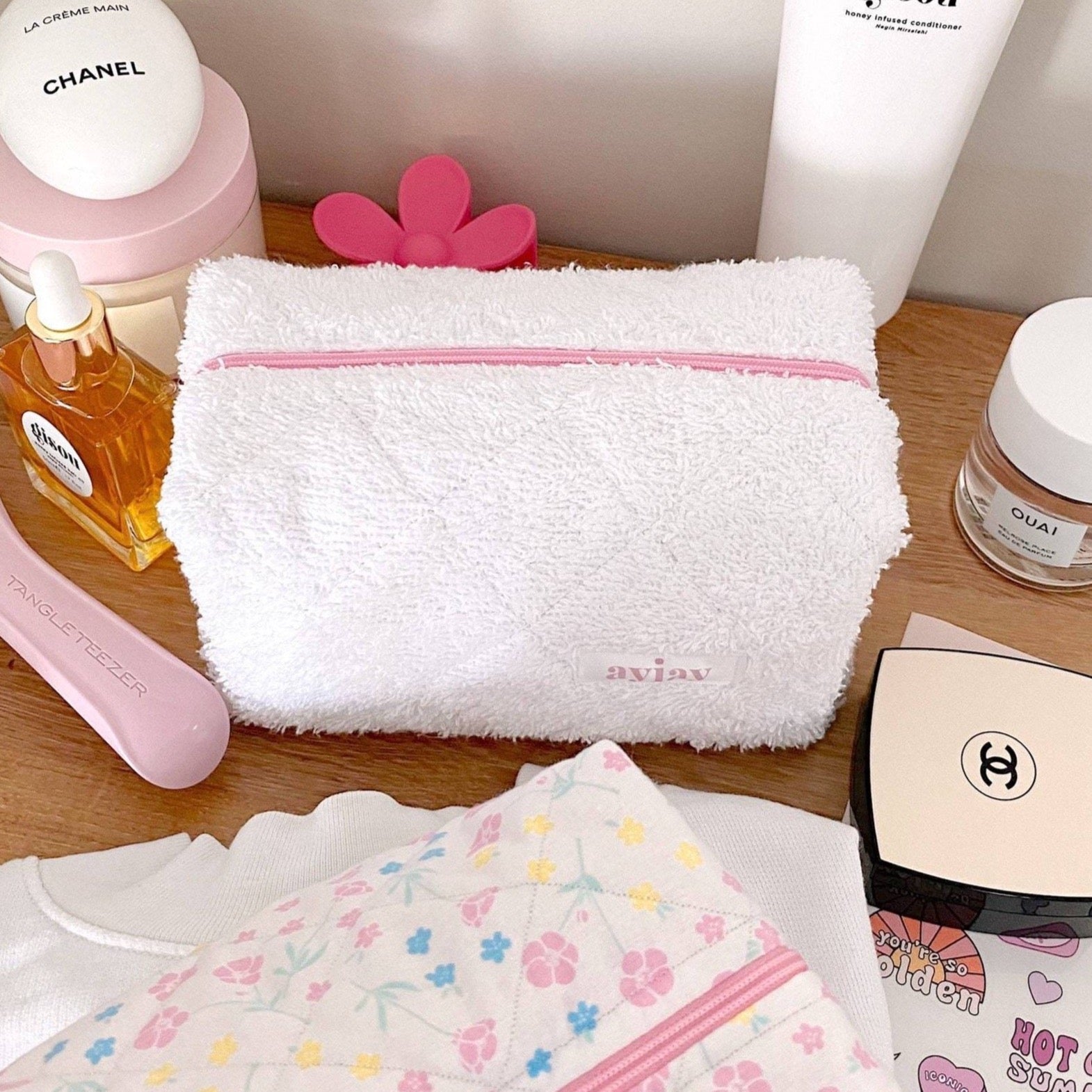 White terrycloth pouch with pink zipper